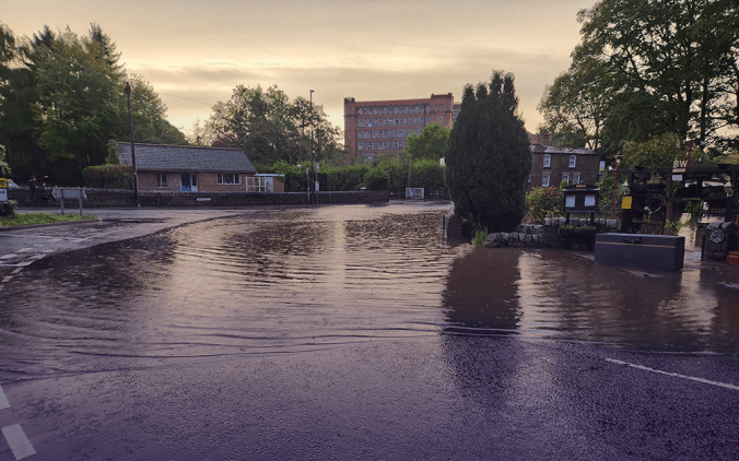 Flooded road in Derbyshire where Derbyshire County Council use Causeway one.network's Live Link app to communicate road closure updates to sat-nav apps in real-time