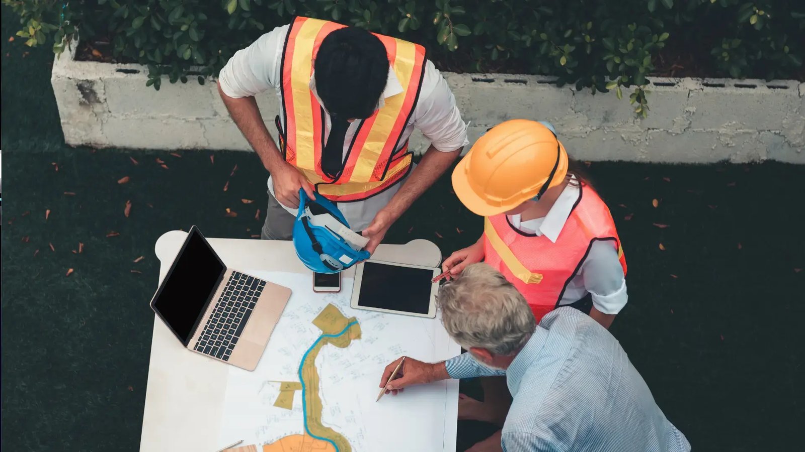 Construction team meeting at laptop - Drainage Design