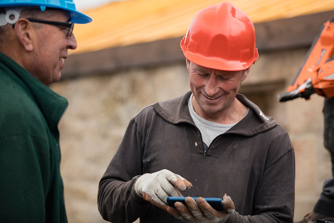 construction worker using phone