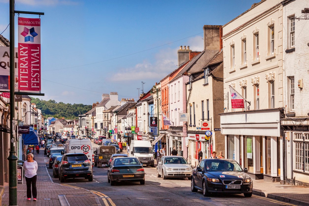 onmouthshire, Wales, UK - Monnow Street, the main shopping street in the town, with a banner advertising the Literary Festival.